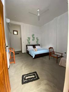 Postel nebo postele na pokoji v ubytování One FS Hotel Arugambay