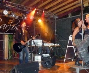 a group of people playing music on a stage at Green Mile Motel in Nideggen