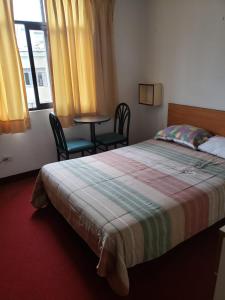 Postel nebo postele na pokoji v ubytování Hospedaje Miraflores 17