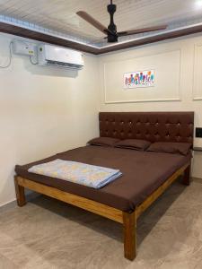 Postel nebo postele na pokoji v ubytování BoganVilla by Malpe + 8 fotografií