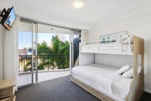 Ένα ή περισσότερα κρεβάτια σε δωμάτιο στο Surfers Paradise 2 bedroom Oasis