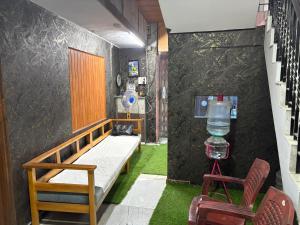 a hospital room with a bed and a bottle of water at AJ GrandInn in Podanūr