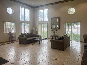 a large living room with two couches and windows at Oceanside, CA – Marina / Camp Pendleton in Oceanside