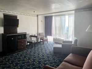 a hotel room with a living area with a television at Oceanside, CA – Marina / Camp Pendleton in Oceanside