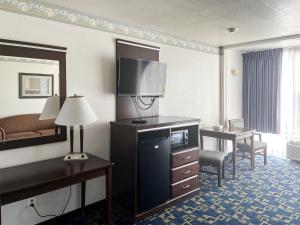 a hotel room with a bed and a television at Oceanside, CA – Marina / Camp Pendleton in Oceanside