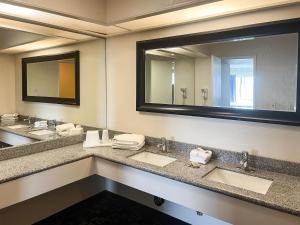 a bathroom with two sinks and a large mirror at Oceanside, CA – Marina / Camp Pendleton in Oceanside +37 photos
