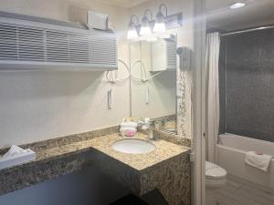a bathroom with a sink and a toilet at Oceanside, CA – Marina / Camp Pendleton in Oceanside