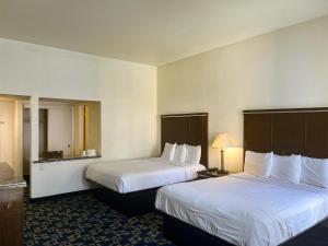 a hotel room with two beds and two lamps at Oceanside, CA – Marina / Camp Pendleton in Oceanside
