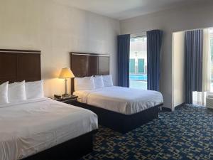 a hotel room with two beds and a window at Oceanside, CA – Marina / Camp Pendleton in Oceanside