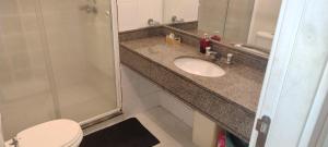 a bathroom with a sink and a toilet at Flat Aeroporto Congonhas in Sao Paulo +3 photos