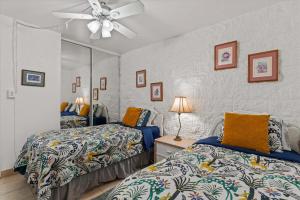 Ένα ή περισσότερα κρεβάτια σε δωμάτιο στο Experience oceanfront luxury at Kanai A Nalu 209, a Spacious 2-Bd/2Ba condo, AC +76 φωτογραφίες