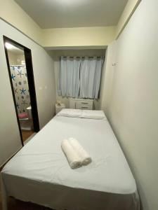 Ένα ή περισσότερα κρεβάτια σε δωμάτιο στο Apt 3quartos l 2suítes