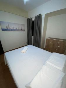 Ένα ή περισσότερα κρεβάτια σε δωμάτιο στο Apt 3quartos l 2suítes