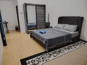 Ένα ή περισσότερα κρεβάτια σε δωμάτιο στο Astana View Homestay