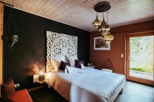 Postel nebo postele na pokoji v ubytování B&B A L'aise