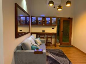 a living room with a couch and a table at Moana La Vie - Polhena in Matara