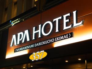 a sign for a hotel on the side of a building at APA Hotel Nambaminami Daikokucho Ekimae in Osaka