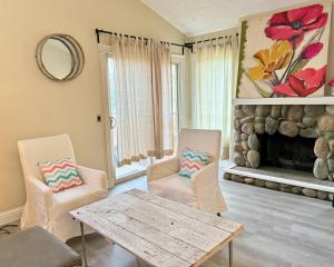 a living room with a table and chairs and a fireplace at Banff mountain House&30 second Bus station Close C-Train& Free Parking in Calgary +13 photos