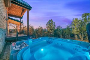 a hot tub on the side of a house at Cactus Canyon Retreat Zion Base Hot Tub View in Orderville