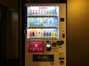 a vending machine filled with bottles of drink at APA Hotel Nambaminami Daikokucho Ekimae in Osaka