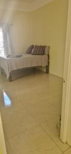 Ένα ή περισσότερα κρεβάτια σε δωμάτιο στο Bella's Cottage +4 φωτογραφίες
