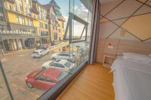 Ένα ή περισσότερα κρεβάτια σε δωμάτιο στο 7 Days Premium Qingdao World of Ocean Qingdao University