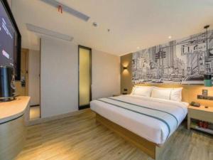 Ένα ή περισσότερα κρεβάτια σε δωμάτιο στο City Comfort Inn Changsha Huanghua Airport Yong'an +98 φωτογραφίες