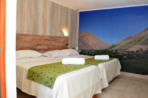 Voodi või voodid majutusasutuse Hostal Valle Mistral toas