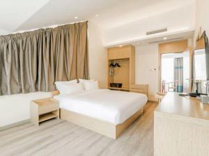 Postel nebo postele na pokoji v ubytování ZMAX Hotels Wuhan East Lake + 223 fotografií