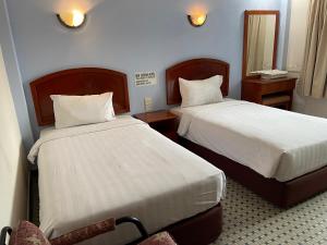 Postel nebo postele na pokoji v ubytování New Caspian Hotel