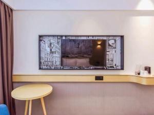 Μια τηλεόραση ή/και κέντρο ψυχαγωγίας στο City Comfort Inn Chongqing Yongchuan Xuefu Avenue Wanda +115 φωτογραφίες