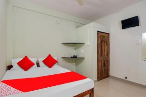 Postel nebo postele na pokoji v ubytování Hotel O K S Inn Hotel
