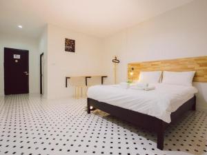 Postel nebo postele na pokoji v ubytování Maalamaii Hotel