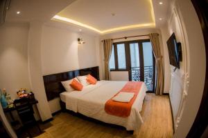 Ένα ή περισσότερα κρεβάτια σε δωμάτιο στο Laverne Hotel