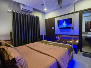 Giường trong phòng chung tại Kha Thy Hotel