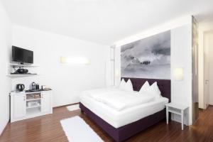 Postel nebo postele na pokoji v ubytování Hotel Payerbacherhof
