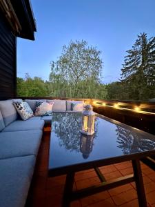 Χώρος καθιστικού στο Pavillon Am Kurpark - Top bewertet von Familien! Zentral, modern, ruhig - mit Balkon, Grill, Parkplatz, Wallbox und inklusive Wäschepaket