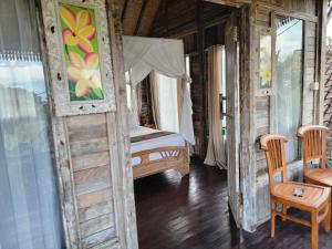 Postel nebo postele na pokoji v ubytování Ananda JJ Ubud Resort & Spa