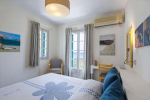 Кровать или кровати в номере Byzantio Beach Suites & Wellness