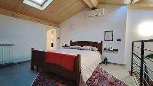 a bedroom with a bed in a room with a ceiling at La casa di E in Sesto Fiorentino