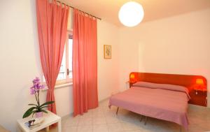 Ένα ή περισσότερα κρεβάτια σε δωμάτιο στο Tizi Apartments Porto