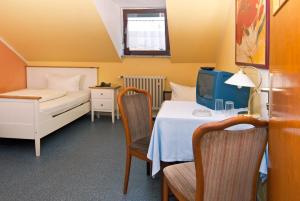 Postel nebo postele na pokoji v ubytování Hotel Kugel