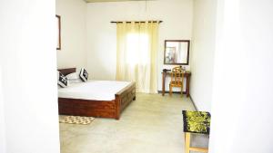 Rúm í herbergi á Jungle Edge Home Sigiriya