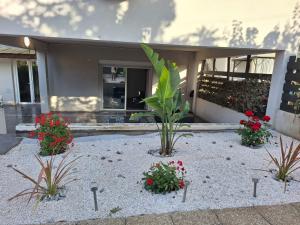 a garden in front of a house with flowers at Calanques de Sormiou in Marseille