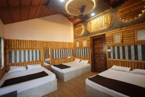 Ένα ή περισσότερα κρεβάτια σε δωμάτιο στο Ananthya Farmstay