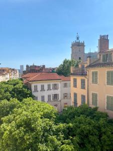 a group of buildings and trees in a city at T3 Chaleureux - Vieux Toulon - Proche Port in Toulon