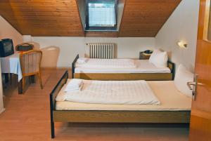 Postel nebo postele na pokoji v ubytování Hotel Kugel