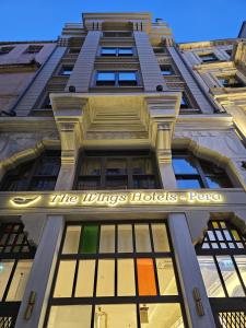 a building with the kings holds hotel sign on it at The Wings Hotels Pera in Istanbul