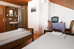 Postel nebo postele na pokoji v ubytování Hotel Kugel