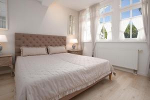 Ein Bett oder Betten in einem Zimmer der Unterkunft Villa Eden Binz Typ 3 / Apartment 12
